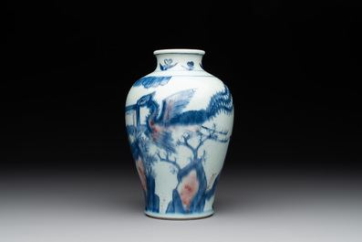 A Chinese blue, white and copper-red 'kylin and phoenix' vase, 19th C.