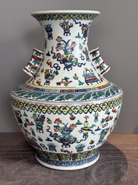 A Chinese doucai 'antiquities' 'hu' vase, Qianlong mark, 19th C.