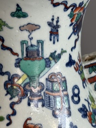 A Chinese doucai 'antiquities' 'hu' vase, Qianlong mark, 19th C.