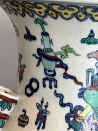 A Chinese doucai 'antiquities' 'hu' vase, Qianlong mark, 19th C.