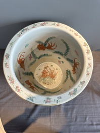 A Chinese famille rose yellow-ground relief-molded 'antiquities' fish bowl, Zhengde mark, 19th C.