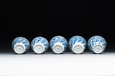 Five Chinese blue and white cups and saucers with floral design, Yu 玉 mark, Kangxi