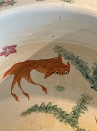 A Chinese famille rose yellow-ground relief-molded 'antiquities' fish bowl, Zhengde mark, 19th C.