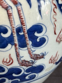 A Chinese blue, white and copper-red 'dragon and phoenix' vase, 19th C.