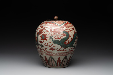 A Chinese Swatow green- and red-enamelled 'dragon' jar and a pair of covered bowls, Ming
