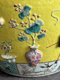 A Chinese famille rose yellow-ground relief-molded 'antiquities' fish bowl, Zhengde mark, 19th C.