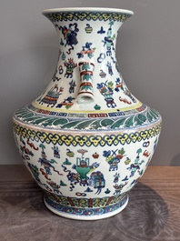 A Chinese doucai 'antiquities' 'hu' vase, Qianlong mark, 19th C.