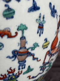 A Chinese doucai 'antiquities' 'hu' vase, Qianlong mark, 19th C.