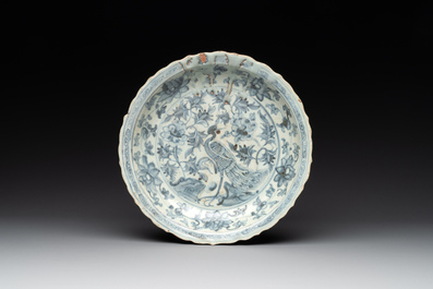 A Chinese blue and white 'phoenix' dish and two 'Buddhist lion' and 'peony' plates, Hongzhi/Zhengde