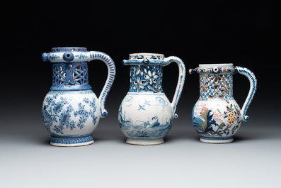 Two blue and white and one polychrome Dutch Delft puzzle jugs, dated 1734 and 1705, 18th C. and later