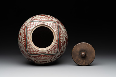 A Chinese Swatow green- and red-enamelled 'dragon' jar and a pair of covered bowls, Ming