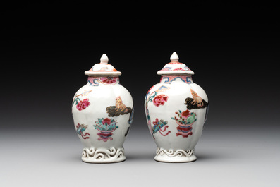 A pair of Chinese famille rose 'antiquities' tea caddies and covers, Yongzheng/Qianlong