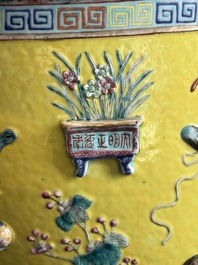 A Chinese famille rose yellow-ground relief-molded 'antiquities' fish bowl, Zhengde mark, 19th C.