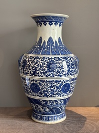 A large Chinese blue and white 'flower scroll' vase, Qianlong mark, 19th C.