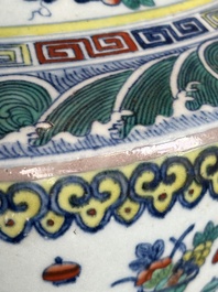 A Chinese doucai 'antiquities' 'hu' vase, Qianlong mark, 19th C.