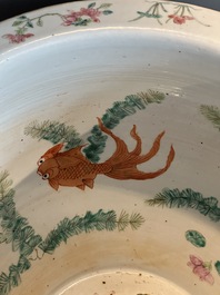A Chinese famille rose yellow-ground relief-molded 'antiquities' fish bowl, Zhengde mark, 19th C.