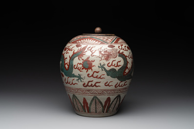 A Chinese Swatow green- and red-enamelled 'dragon' jar and a pair of covered bowls, Ming