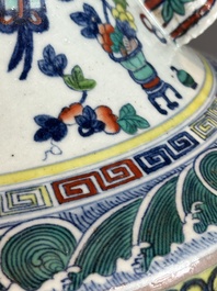 A Chinese doucai 'antiquities' 'hu' vase, Qianlong mark, 19th C.