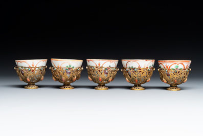An Ottoman coral-and-turquoise-inlaid gilt-copper tea service with five Chinese wucai cups, 19th C.
