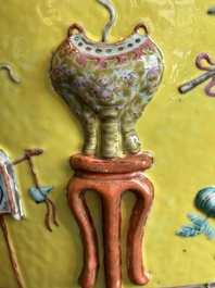 A Chinese famille rose yellow-ground relief-molded 'antiquities' fish bowl, Zhengde mark, 19th C.
