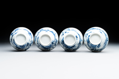 Four Chinese blue and white 'landscape' cups and saucers, Kangxi