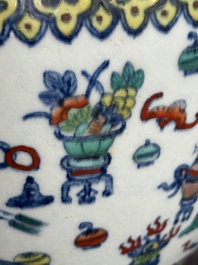 A Chinese doucai 'antiquities' 'hu' vase, Qianlong mark, 19th C.