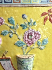 A Chinese famille rose yellow-ground relief-molded 'antiquities' fish bowl, Zhengde mark, 19th C.