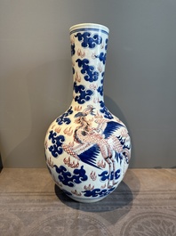 A Chinese blue, white and copper-red 'dragon and phoenix' vase, 19th C.
