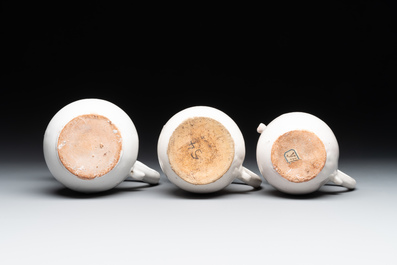 Three French white-glazed and two polychrome puzzle jugs, Nevers, 18th C.