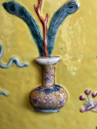 A Chinese famille rose yellow-ground relief-molded 'antiquities' fish bowl, Zhengde mark, 19th C.