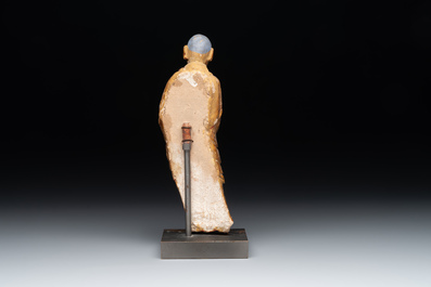 A Chinese gilt and polychromed stucco figure of a monk, Ming