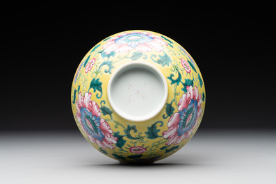 A Chinese famille rose yellow-ground 'peony' bowl, 20th C.