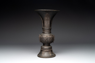 A Chinese archaistic bronze 'gu' vase with relief design, Ming