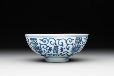 A Chinese blue and white 'fu and shou' bowl with flower scrolls, Yongzheng mark and of the period
