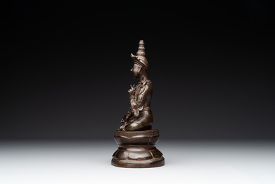 A Vietnamese bronze deity on a lotus throne, 18/19th C.