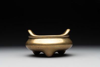 A Chinese bronze tripod censer on a wooden stand, Song Zhu Xuan 松竹軒 mark, 18th C.