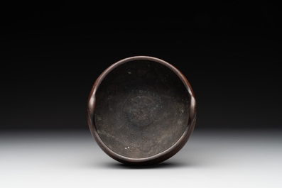 A Chinese bronze tripod censer, Xuande mark, Ming