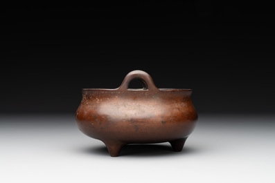 A Chinese bronze tripod censer, Xuande mark, Ming