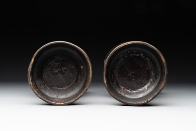 A pair of Chinese bronze vases with 'dragon' handles, Yuan/Ming