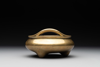 A Chinese bronze tripod censer on a wooden stand, Song Zhu Xuan 松竹軒 mark, 18th C.