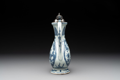 A Chinese silver-mounted blue and white ewer with figures in a landscape, Ming