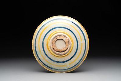 An Italian maiolica dish with 'Adam and Eve being expelled from paradise', 16/17th C.