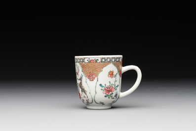 A fine Chinese famille rose armorial cup and two saucers, Yongzheng/Qianlong