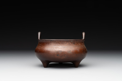 A Chinese bronze tripod censer, Xuande mark, Ming