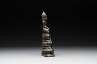 A Laotian bronze figure of a seated Buddha, 19th C.