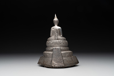 A Cambodian silver repouss&eacute; Buddha with inscription, 19th C.