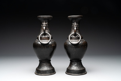 A pair of Chinese bronze vases with 'dragon' handles, Yuan/Ming