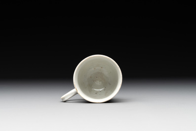 A fine Chinese famille rose armorial cup and two saucers, Yongzheng/Qianlong