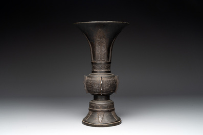 A Chinese archaistic bronze 'gu' vase with relief design, Ming