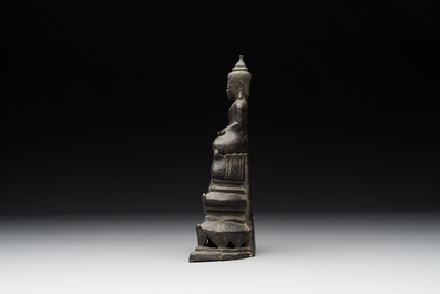 A Laotian bronze figure of a seated Buddha, 19th C.